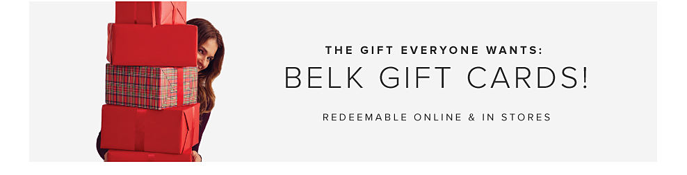 Image of woman with gifts. The gift everyone wants: Belk Gift Cards! Use them at belk.com & Belk store. 