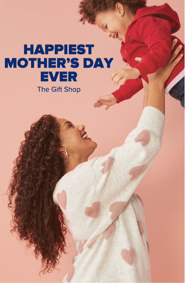 A woman wearing an ivory sweater with pink hearts holding up a little boy in denim pants and a red jacket. Happiest mother's day ever. The gift shop. A notification pops up. Friendly reminder. Mother's day is Sunday, May 9th. Shop now. Save big.