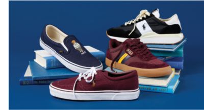 Image of Polo Ralph Lauren sneakers laying on top of books