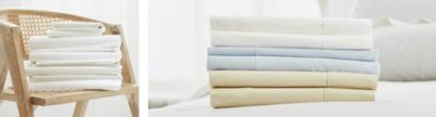 white sheets on a chair and nicely folded sheets