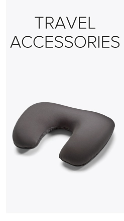 A gray neck pillow. Shop travel accessories.