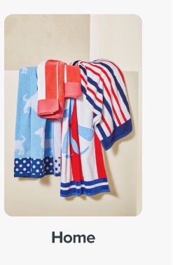 Image of various towels in red, white and blue. Shop home.
