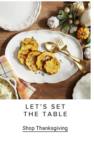 An image of a table with a pumpkin centerpiece, a plate with food on top and silverware. Let's set the table. Shop Thanksgiving.