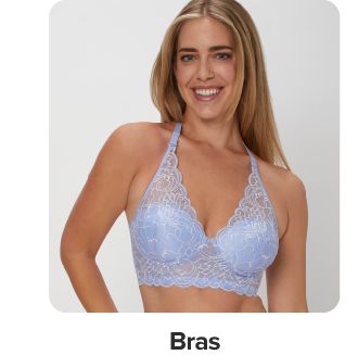 Image of a woman wearing a lavender lacy bra. Shop bras. 