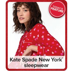 Image of a woman wearing heart print pajamas. Kate Spade New York sleepwear.