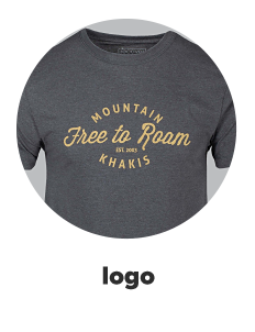 A gray Mountain Khakis tee shirt that says free to roam. Logo. 