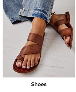 Image of brown strappy sandals. Shop shoes.