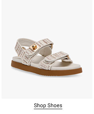 White sandal with two Velcro straps. Shop Shoes