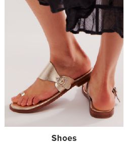 Image of a woman wearing sandals. Shoes. 