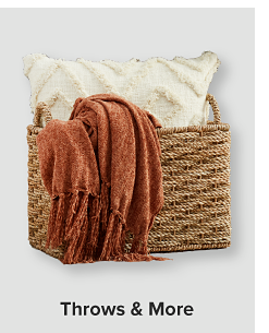 Basket filled with blankets. Throws and more