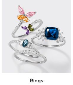 An image of diamond rings with gemstones. Shop rings.