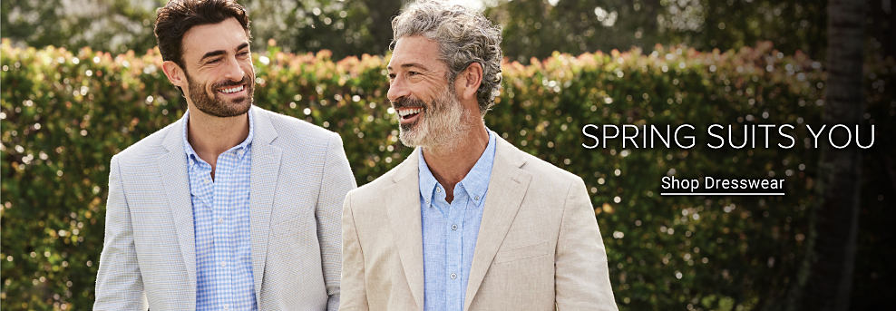 Two men in beige sport coats over button up dress shirts. Spring suits you. Shop dresswear.