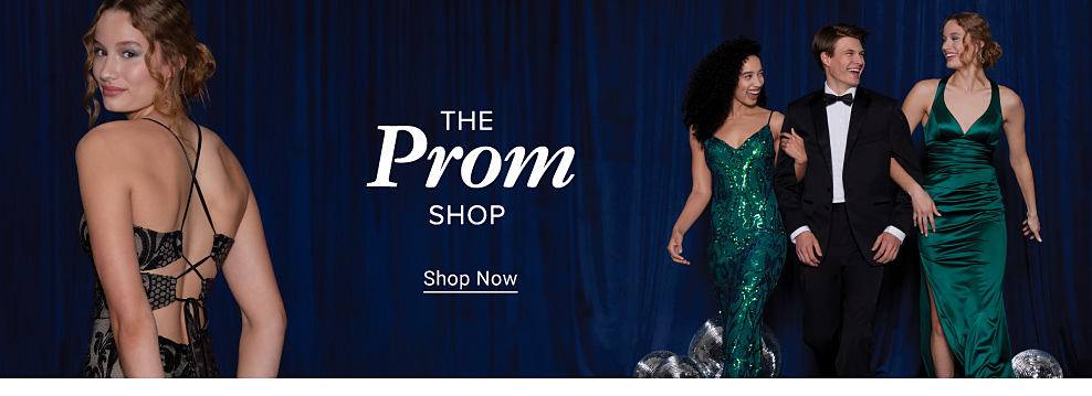 Image of 3 young women and 1 man wearing formal fashion. The prom shop.