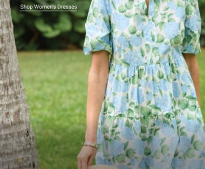 A woman in a light blue dress with flowers on it.