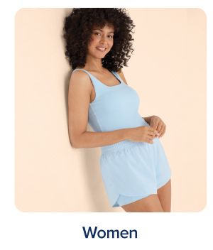 Shop women. A woman in a blue tanktop and shorts.
