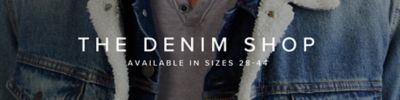 The denim shop. Available in sizes 28 to 44. A background image zoomed in on a man wearing a denim jacket. 