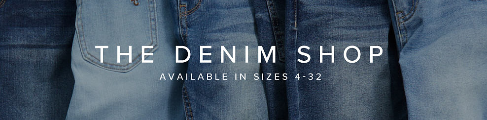 A background image of overlapping jeans. The denim shop. Available in sizes 4 to 32. 