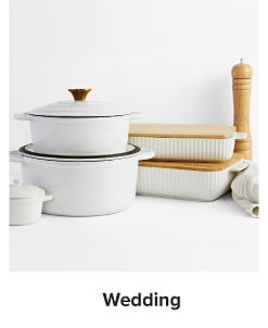 An image of white Dutch ovens and assorted cookware and accessories. Shop wedding. 