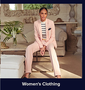 An image of a woman in a pink suit. Shop women's clothing. 