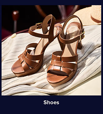 An image of brown strapped heels. Shop shoes. 