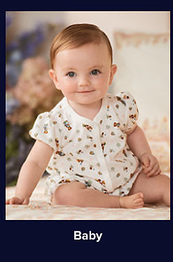 An image of a baby in a onesie, sitting up. Shop baby. 