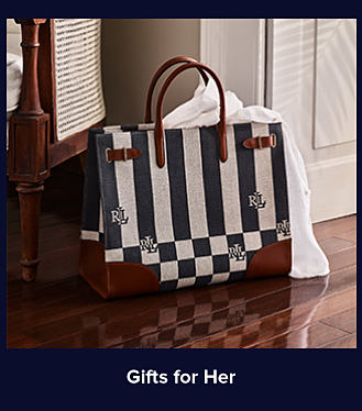 An image of a blue and white striped handbag. Shop gifts for her. 