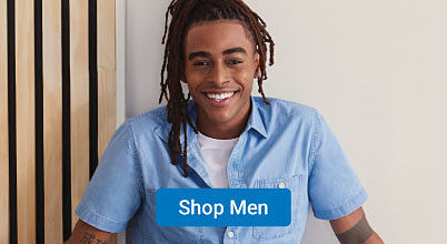 A man in a light blue button up shirt. Shop men.
