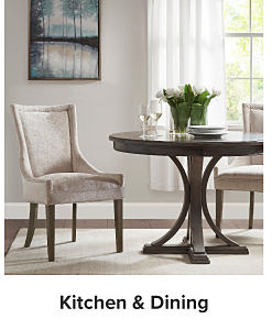An image of a table and a chair. Shop kitchen and dining.