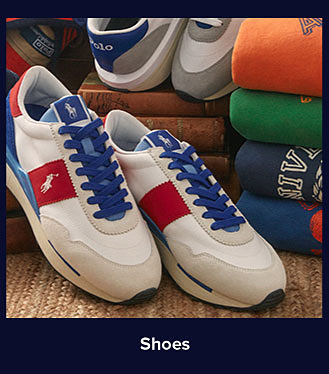 A pair of red, white and blue Polo Ralph Lauren shoes. Shop shoes.