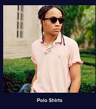 A man in a pink Polo shirt. Shop Polo shirts.