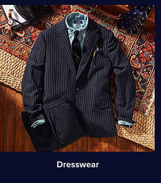A black suit with blue dress shirt. Shop dresswear.