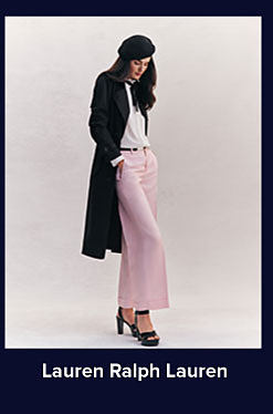 A woman in a black beret, black overcoat and pink pants. Shop Lauren Ralph Lauren.