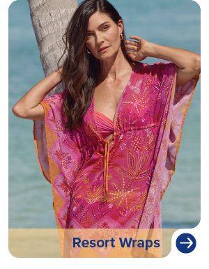 Image of a woman wearing a printed swimsuit coverup. Resort wraps.