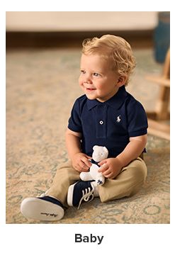 A baby in a blue polo shirt. Baby.