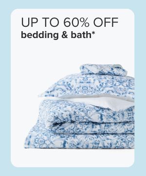 Up to 60% off bedding and bath. Stack of blue floral bedding. 