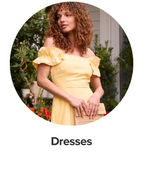 An image of a woman wearing a yellow dress. Dresses.