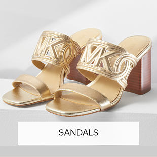 An image of gold sandals. Shop sandals. 