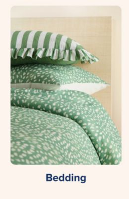 Shop bedding. Matching green throw pillows and bedspread.