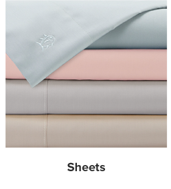 A stack of folded sheets in a variety of colors. Shop sheets.