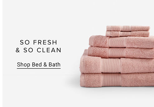 An image of a stack of pink hand, wash and bath towels. So fresh and so clean. Shop bed and bath. 