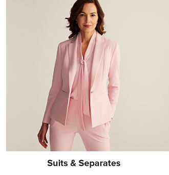 Image of a woman wearing a pink suit and blouse. Shop suits and separates.