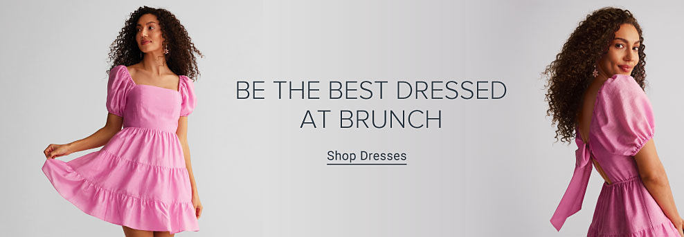 Image of a girl wearing a pink dress with puffy sleeves. Be the best dressed at brunch. Shop dresses.