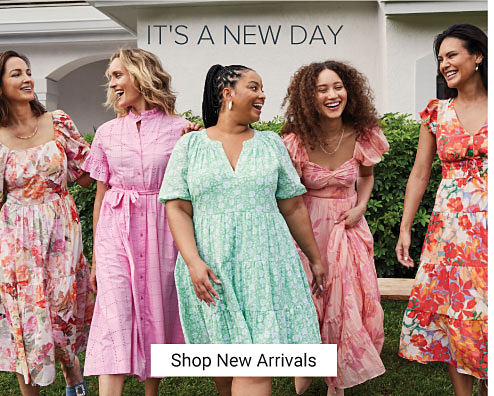 An image of a group of women wearing pretty spring dresses. It's a new day. Shop new arrivals.