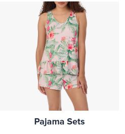 An image of a woman wearing floral pajamas. Shop pajama sets.