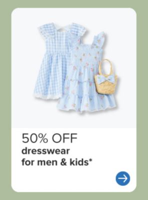 Two blue girls' dresses and a basket. 50% off dresswear for men and kids.
