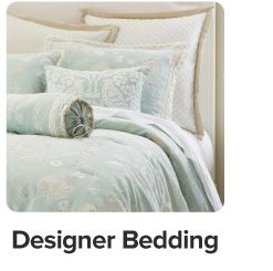 An image of a bed. Designer bedding.