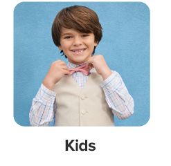 A boy in a button up shirt, vest and bowtie. Shop kids.