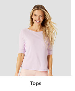 A woman in a pink top. Tops.