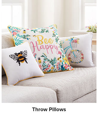 Image of throw pillows on a couch. Shop throw pillows.