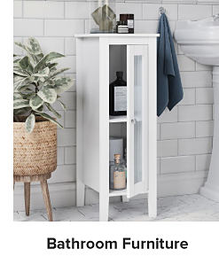 Image of a white cabinet in a bathroom. Shop bathroom furniture.